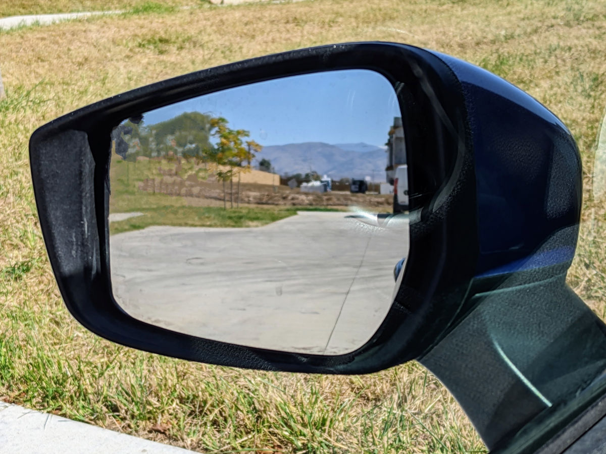 Photo of a side view mirror with no cars visible to the side