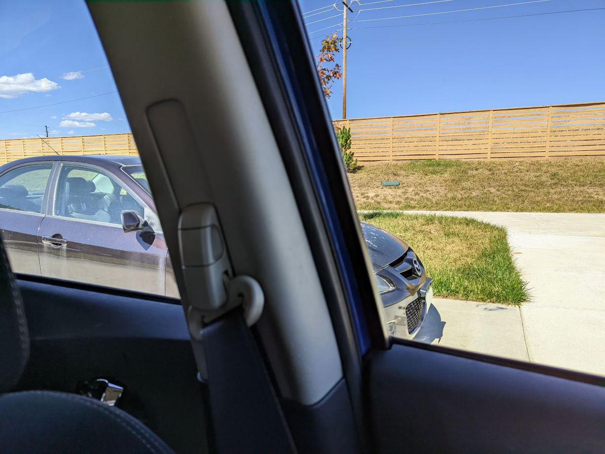 Photo out the driver's side window of the car showing a car directly to the side