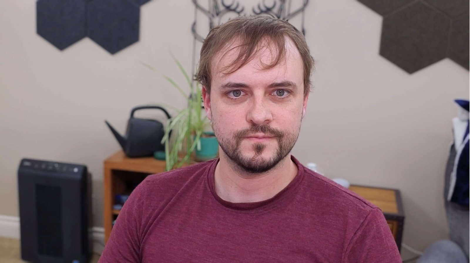 Insta360 Link webcam capture with proper room and key lighting. The image shows excellent quality with natural, accurate skin tones, sharp detail throughout, well-balanced exposure, and no color casts or artifacts. Represents the highest quality webcam capture among all examples shown.